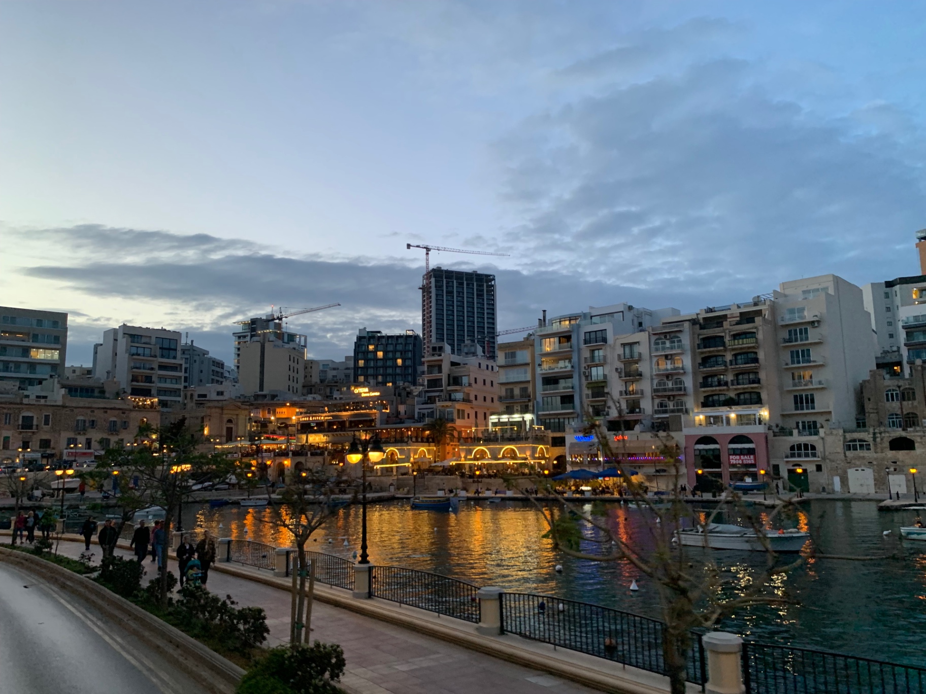 Spinola Bay lit up at dusk